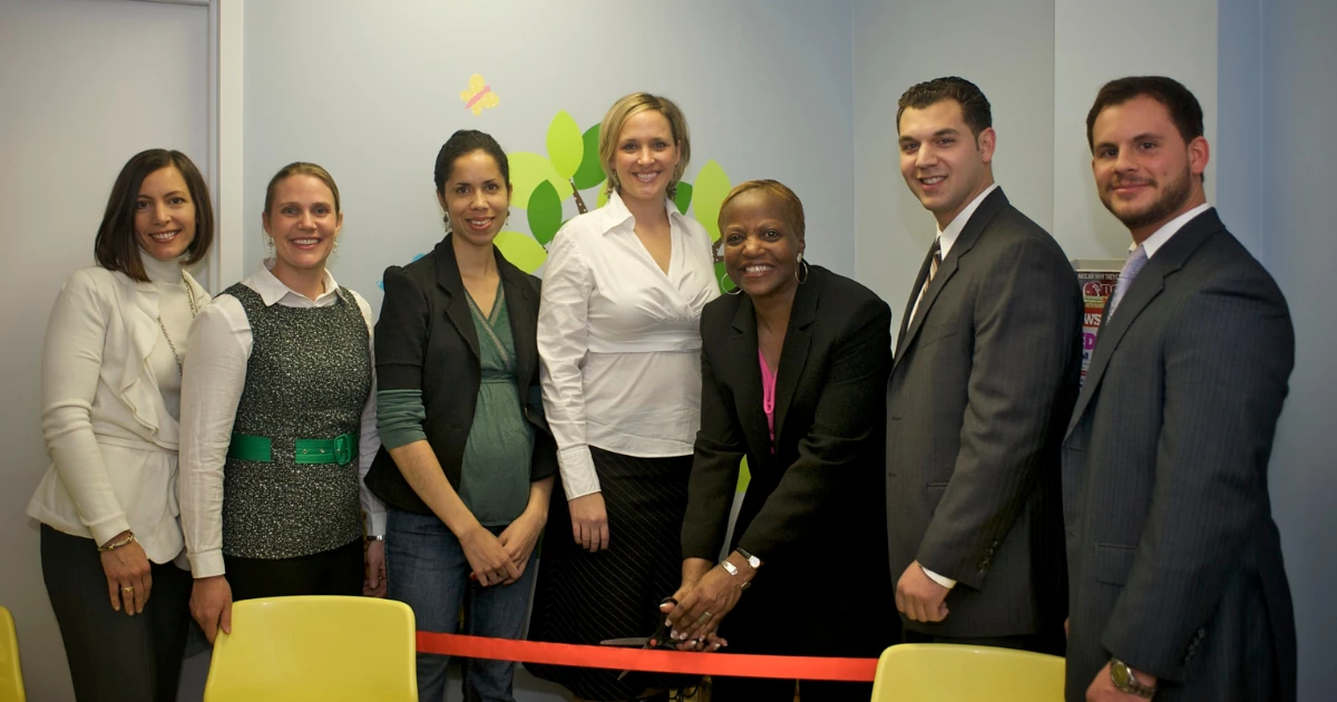 Ribbon cutting at the grand reopening of the renovated Mt. Vernon reception area, with organizers and A.G. Williams representatives looking on.