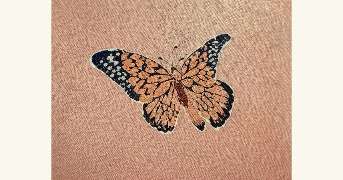 Close-up of the mural showing a butterfly with three antennae.