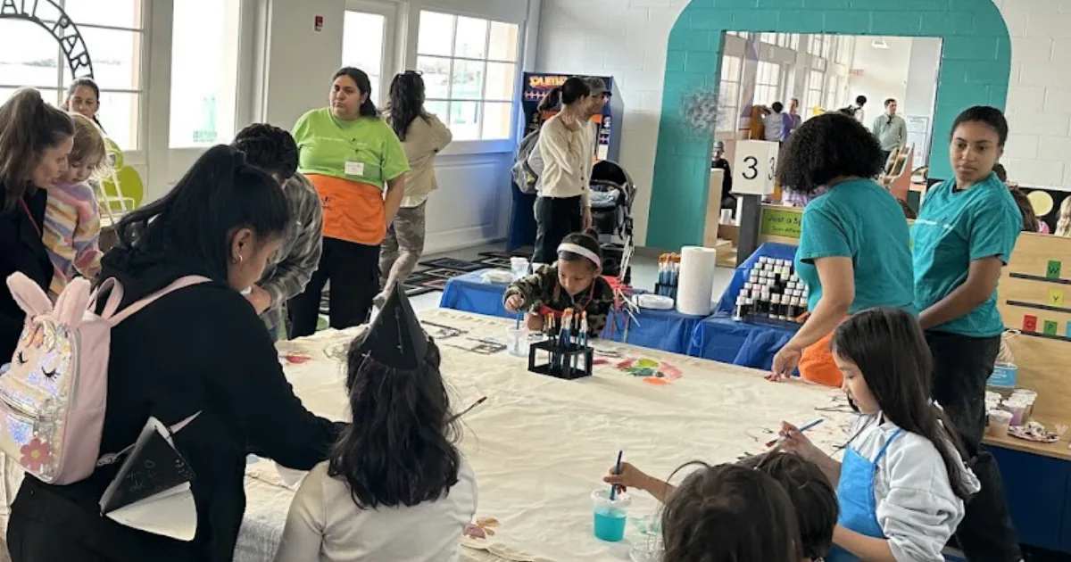 Families paint a community mural at the Westchester Children’s Museum’s 10th-anniversary celebration.