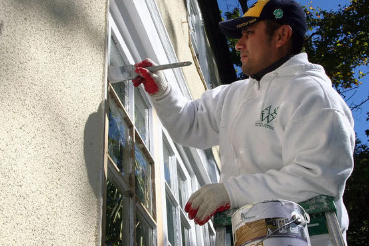 Replacement wood trim installed around an exterior window before priming.