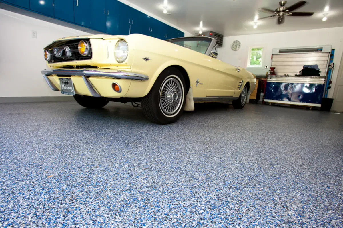 Classic Mustang parked on a finished decorative-flake residential garage floor.