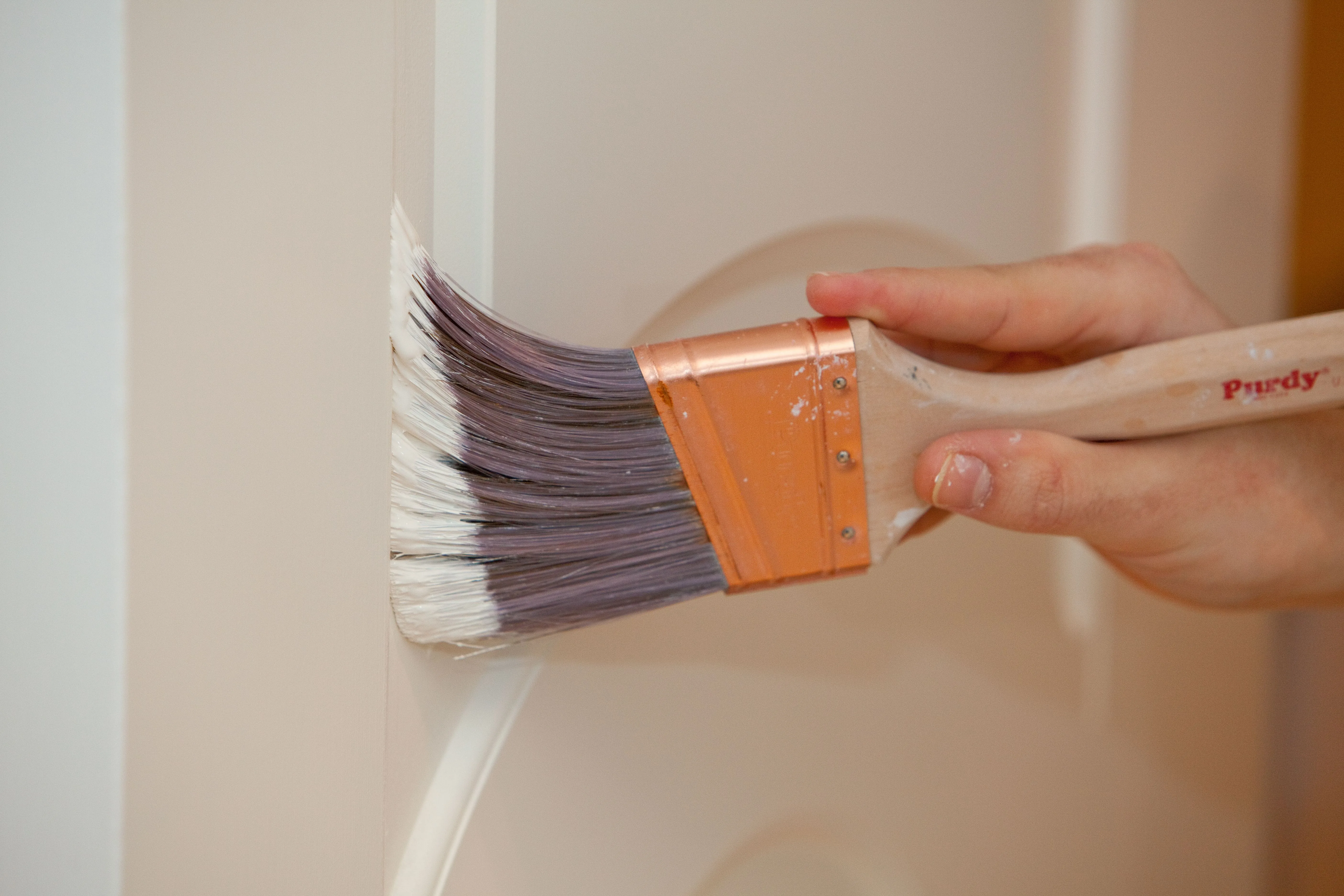 Close brushwork showing a clean cut line on trim.